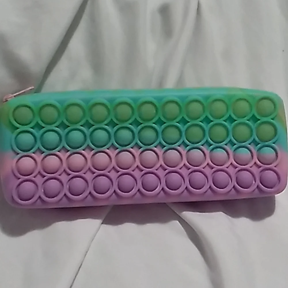 8 x 3 x 1 1/4 inches Purple, pink & green Pop It Case